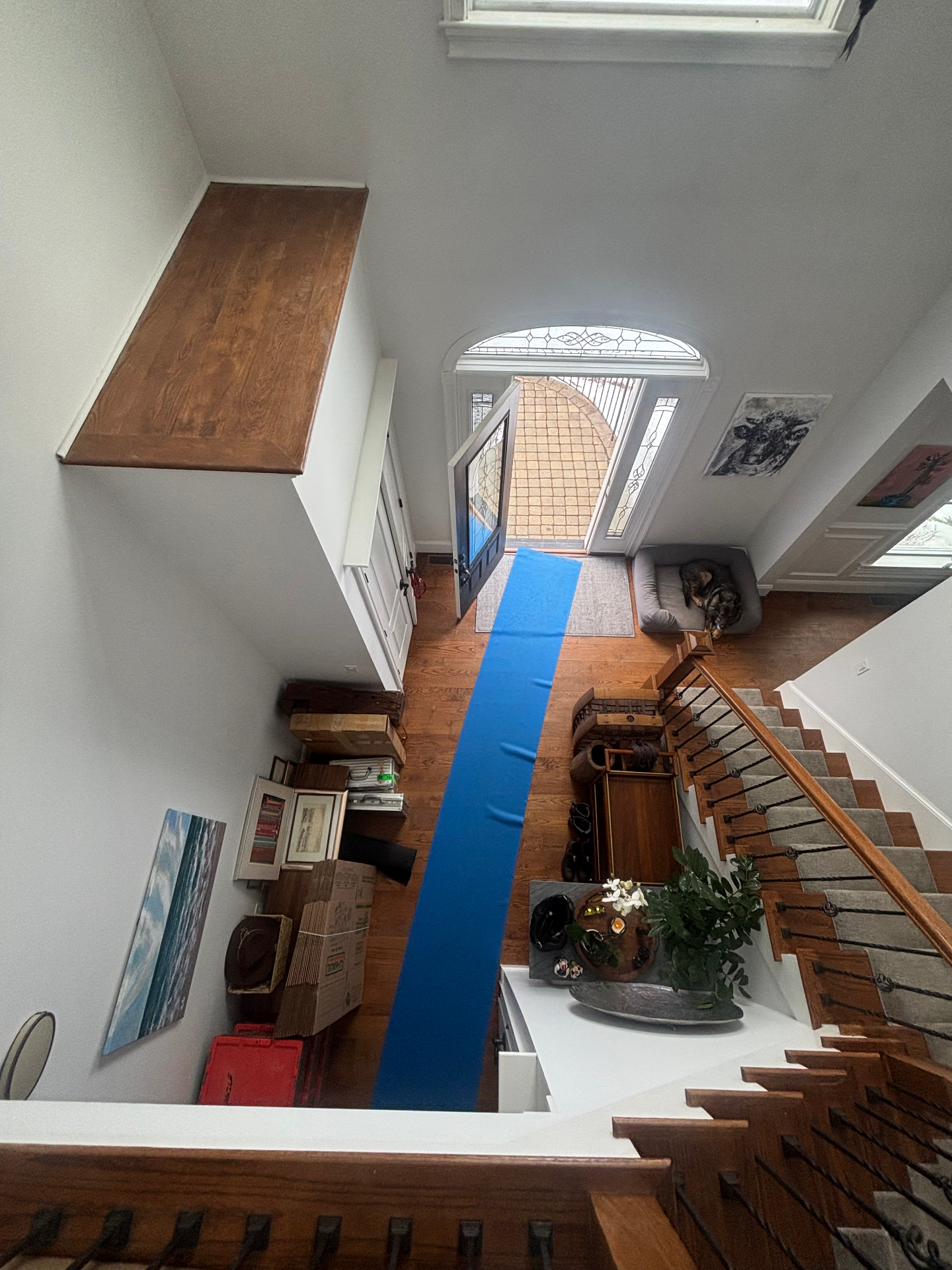 EAM Moving crew protecting a client's entryway with floor runners during a residential move
